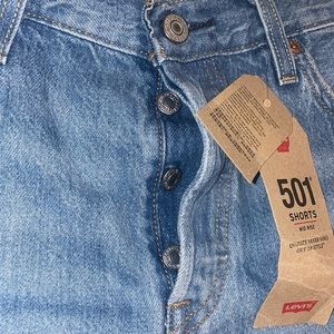 Selling; 501 Levi’s shorts; non stretch; size 29; medium denim color